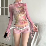 2000年代のフェアリーコアスタイルのピンクのメッシュトップスを送る