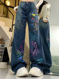 High-waisted graffiti jeans for 90s fashion