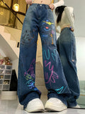 High-waisted graffiti jeans for 90s fashion