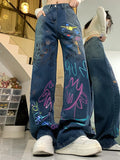 High-waisted graffiti jeans for 90s fashion