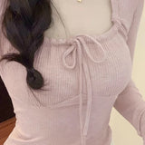 リボンと長袖が付いたニット風のマジカルソフトガールトップス