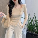 リボンとウェーブヘムのエレガントなベーシックセーター